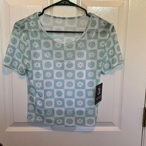 See through green and white t-shirt. Brand new with tags.